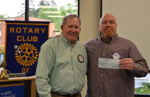 Alan Evans receives a check for Helping Hands from Spike Sumner, Newberg Rotary Foundation 042716