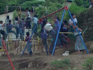 Happy children on swing set